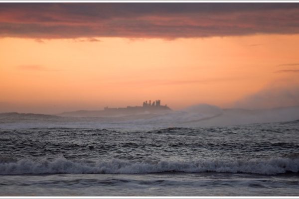 Dunstanburgh Castle from Beadnell Bay by Peter Bishop